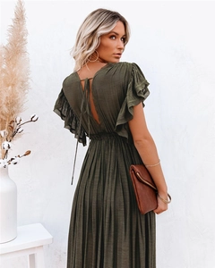 Back view of dark olive green maxi dress featuring ruffle sleeves and open back