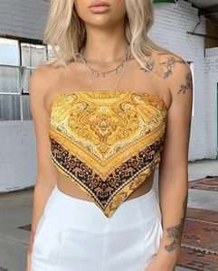 Detail of golden bandana top with baroque paisley pattern and triangular hem