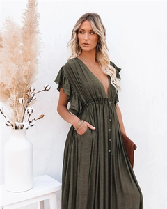 Detailed texture of olive green V-neck maxi dress with ruffled sleeves and buttons
