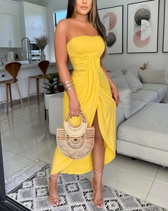 Detail view of the yellow strapless maxi dress featuring side pleats and a high slit