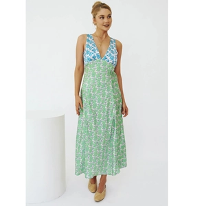 Detail of color-block high-waist maxi dress featuring blue and green floral prints