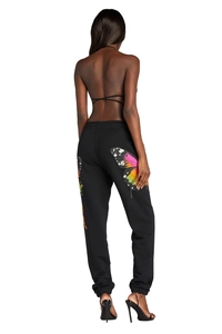 Detail of colorful butterfly print on the back of black women's cuffed sweatpants