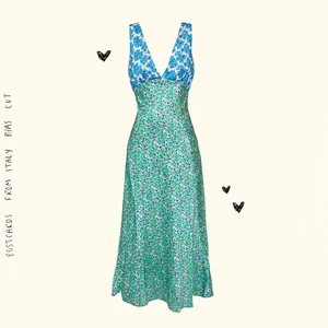Detail showing high-waisted floral print dress with V-neck and Bias Cut design