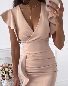 Detail view of pink deep V-neck dress featuring ruffled sleeves and side ruched texture