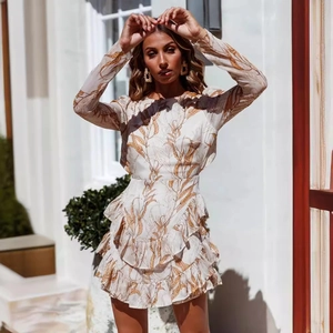 Women's backless mini dress with orange floral print and layered ruffle hemline