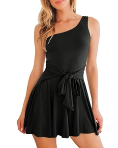 Detail of black one-shoulder romper with tie-waist bow and elegant ruffled hemline
