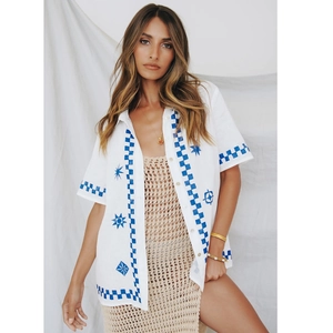 Short sleeve button-up blouse with blue geometric hand-painted prints on white fabric