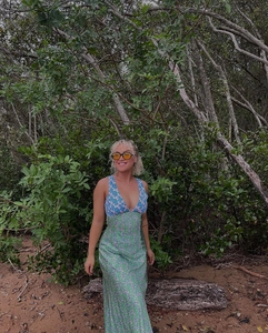 Detail view of high waist floral maxi dress with color-block print and deep V-neckline