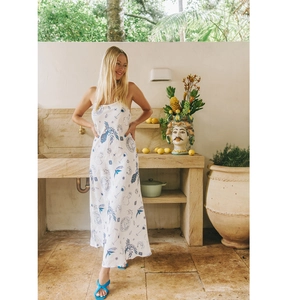 White linen beach maxi dress with blue Mediterranean lemon print and A-line silhouette