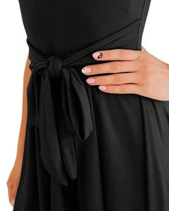 Close-up of elegant self-tie waist belt with pleats on black sleeveless jumpsuit