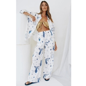 Women's summer white linen set with blue Mediterranean hand-painted prints and wide-leg pants