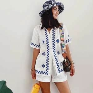 Detail view of cotton-linen shirt and shorts set with blue geometric star prints