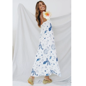 White summer maxi dress with blue Mediterranean prints and thin spaghetti straps