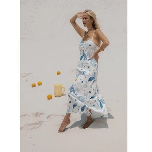 White linen summer maxi dress with blue Mediterranean print and sexy open back beach style