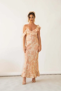 Detailed view of champagne satin dress featuring elegant rose prints and ruffled hemline
