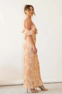Detail of apricot floral maxi dress featuring ruffle neckline and silk-like texture