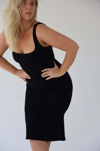 Close-up of velvet bodycon dress featuring a square neckline and wide shoulder straps