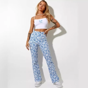 Women's summer fashion set with white LOVE crop top and blue printed flare trousers
