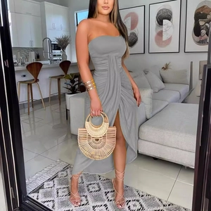 Elegant grey strapless ruched maxi dress with front slit and minimalist lifestyle styling