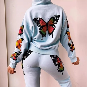 Light blue tracksuit featuring colorful butterfly prints on hoodie and matching joggers