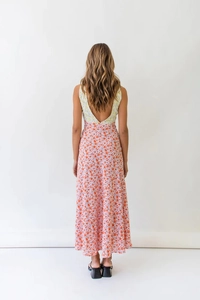 Detail view of the back V-neck design on a floral patchwork high-waist summer dress