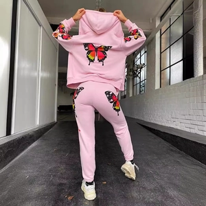 Pink tracksuit featuring hoodie and pants with vibrant gradient butterfly graphics