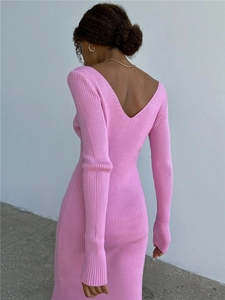 Detail of pink knitted ribbed dress featuring an elegant V-neck back design and soft texture