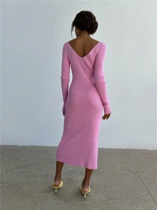 Rear view of a slim-fit pink ribbed knit midi dress with an elegant back V-neckline