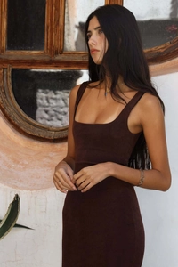 Detail of square neckline and wide straps on a slim fit dark brown velvet dress