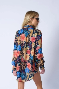 Detail showing the floral and tiger print pattern on navy long-sleeved shirt for women