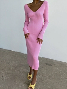 Detail view of pink knit ribbing and slim fit V-neck design on long sleeve dress