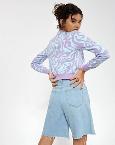 Close-up of stylish lavender and blue wavy knit cardigan with ribbed cuffs and unique pattern