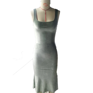 Elegant sage green velvet bodycon dress with square neck and mermaid hem on mannequin