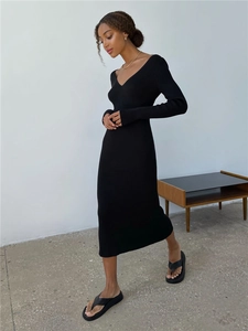 Chic long-sleeved black V-neck ribbed knit midi dress styled with platform sandals