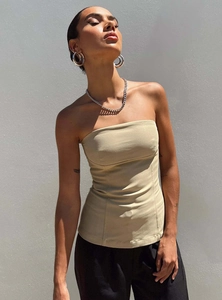 Detail of khaki tube top featuring structured seam lines and slim fit silhouette