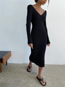 Detail of slim fit rib-knit midi dress with a V-neckline and long sleeves in black