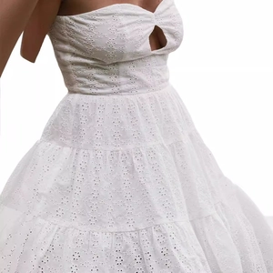 Elegant white lace eyelet tube dress with cutout detail and tiered ruffle skirt