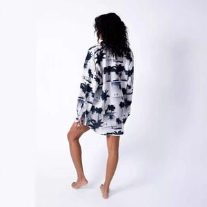 Women's oversized long sleeve blouse with black and white tropical palm tree landscape print