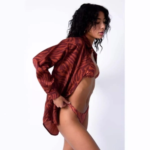 Three-piece women swimsuit with animal print bikini and long-sleeve button-up shirt