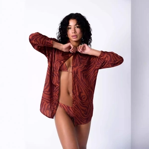 Three-piece women's animal print beach set with oversized shirt and matching bikini