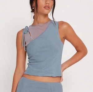 Detail of slim-fit mesh halter top featuring blue-grey fabric and purple mesh neckline