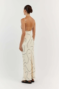 Detail of the open back and thin straps on a printed off-white maxi dress for women
