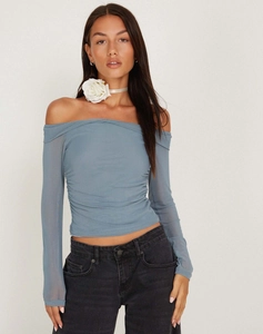 Detail showing the sheer mesh fabric and ruched texture on this blue long sleeve top