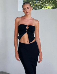 Detail view of black two-piece set with single-breasted crop top and matching long skirt