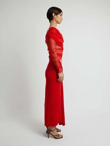 Side view of red mesh long-sleeve top with gathered pleats and matching slim maxi skirt