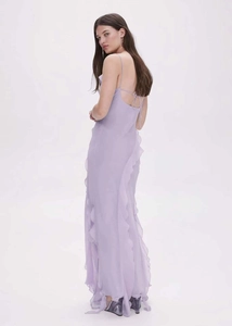 Detail view of the open-back design and ruffle accents on a lavender maxi dress