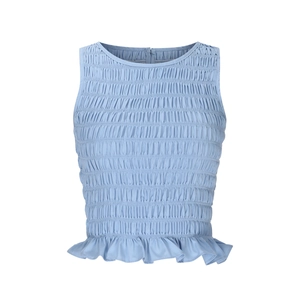 Detail of smocked light blue sleeveless crop top with ruffled hem and back zipper closure