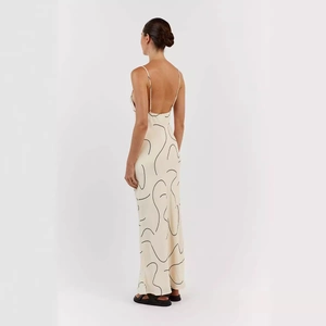 Women's backless maxi dress in cream with abstract black prints and spaghetti straps