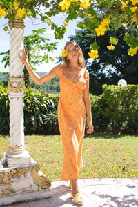 Detail of sexy V-neck summer dress with pink starfish print and ruffle hem in orange