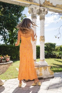 Detail of summer dress featuring a star print pattern and sexy backless design